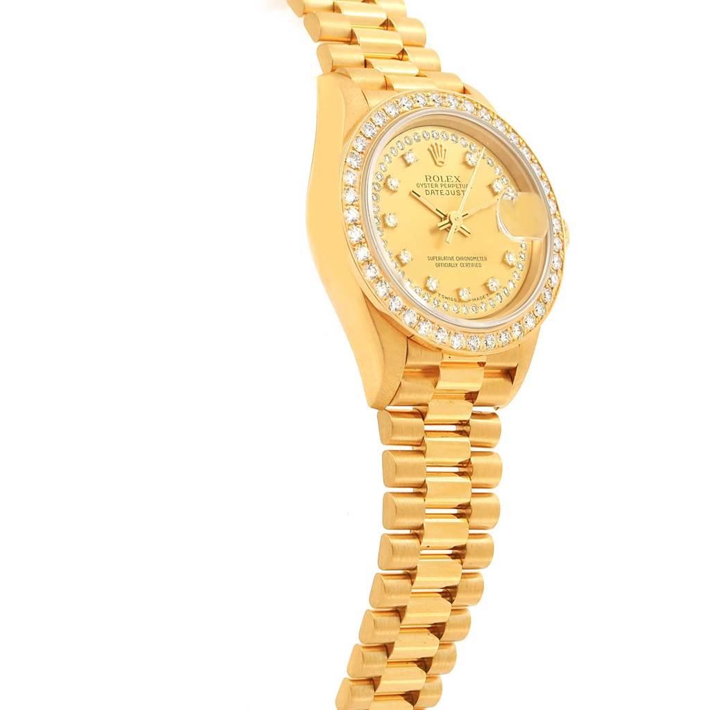 This image shows a Rolex President 69178 Women
s Yellow Gold Champagne Dial 69178 Women
s Yellow Gold Champagne Dial model watch at an angled side view, highlighting its gold case, bracelet, and diamond-encrusted bezel and dial.