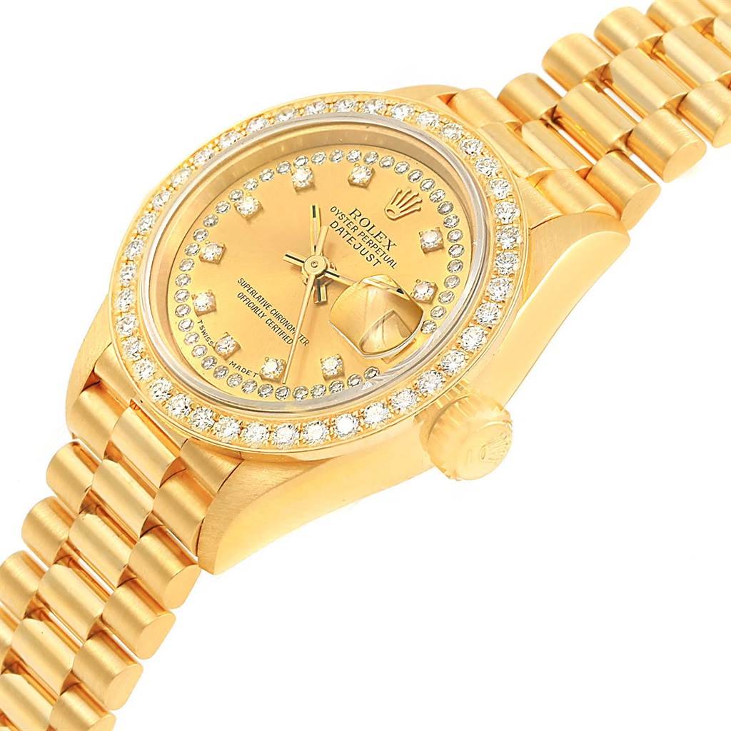 The image shows a diagonally angled view of a Rolex President 69178 Women
s Yellow Gold Champagne Dial 69178 Women
s Yellow Gold Champagne Dial model watch, focusing on its dial, bezel, and part of the bracelet.