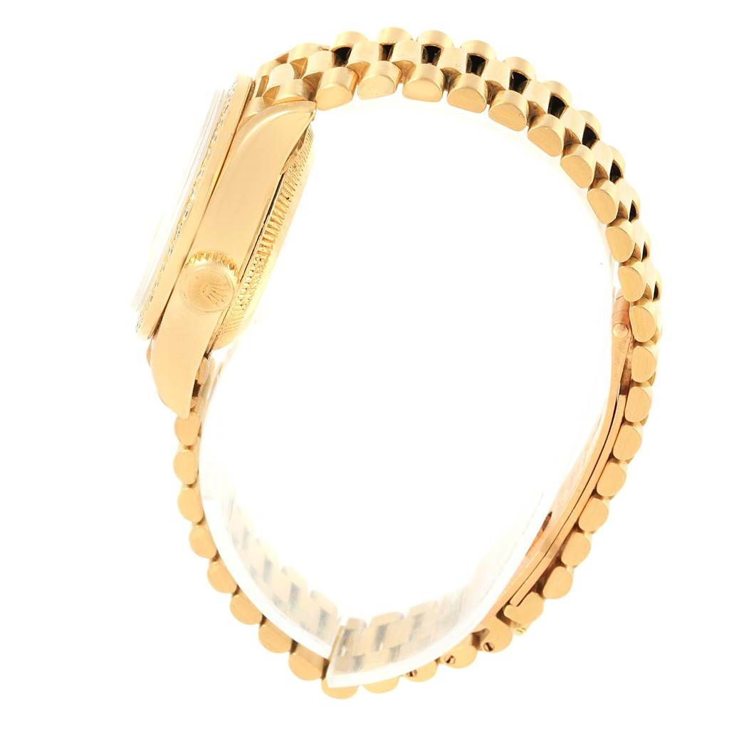 The Rolex President 69178 Women
s Yellow Gold Champagne Dial 69178 Women
s Yellow Gold Champagne Dial model watch is shown from the side angle, highlighting its crown, case, and part of the bracelet.