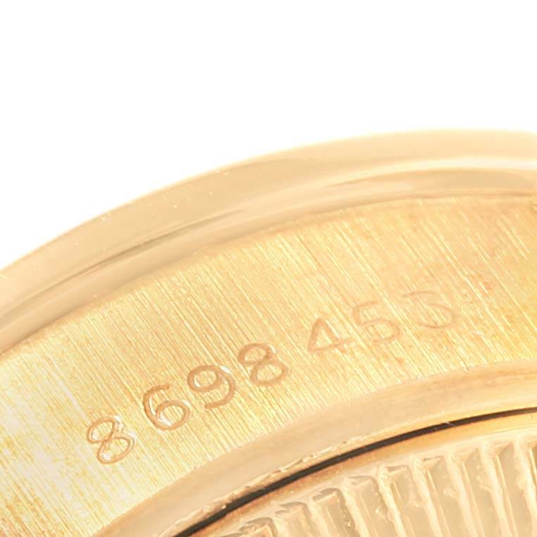 This close-up image shows the engraved serial number on the gold case back of a Rolex President 69178 Women
s Yellow Gold Champagne Dial 69178 Women
s Yellow Gold Champagne Dial model watch.