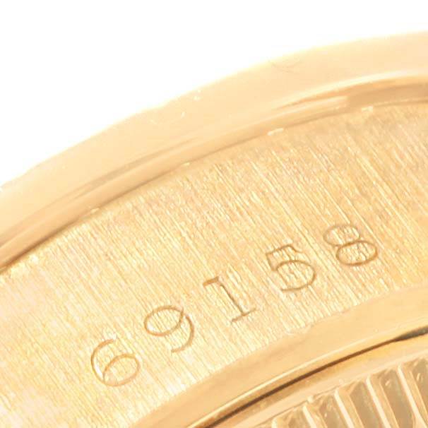 Close-up angle of the side of the Rolex President 69158 Women's Yellow Gold Champagne Dial 69158 Women's Yellow Gold Champagne Dial model watch showing a portion of the engraved serial number "69158."