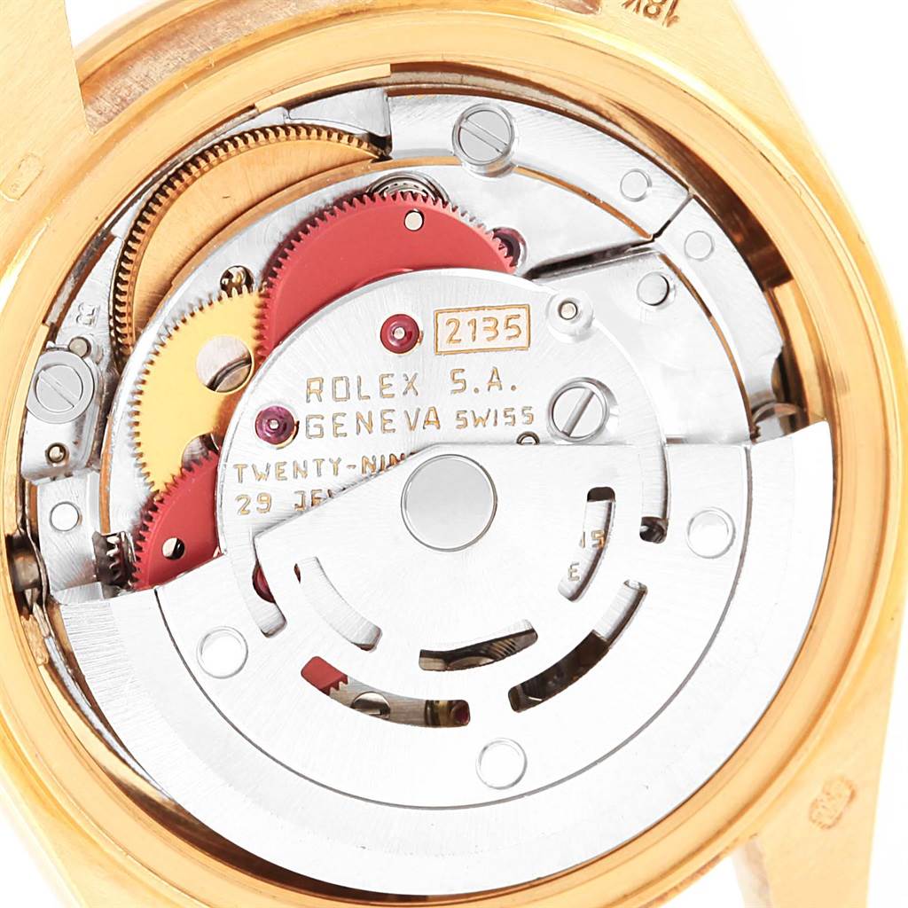 The image shows a close-up of the movement inside a Rolex President 69158 Women's Yellow Gold Champagne Dial 69158 Women's Yellow Gold Champagne Dial model, highlighting the intricate inner mechanisms.