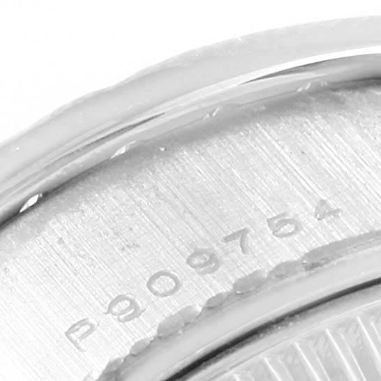 This image shows a close-up of the serial number engraved on the case back of a Rolex President 79159 Women's White Gold Mother of Pearl Dial 79159 Women's White Gold Mother of Pearl Dial model.