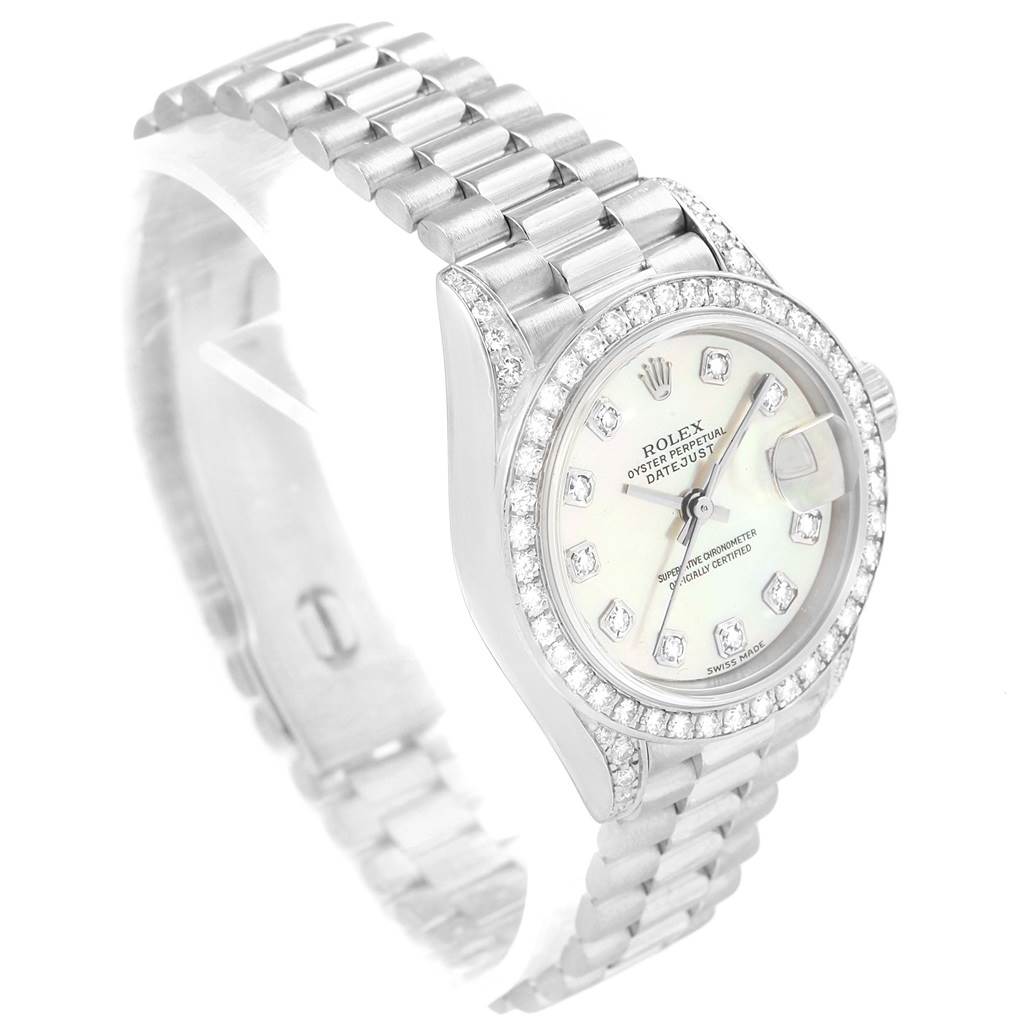 The image shows a Rolex President 79159 Women's White Gold Mother of Pearl Dial 79159 Women's White Gold Mother of Pearl Dial model watch from an angled perspective, highlighting its band, bezel, and face.
