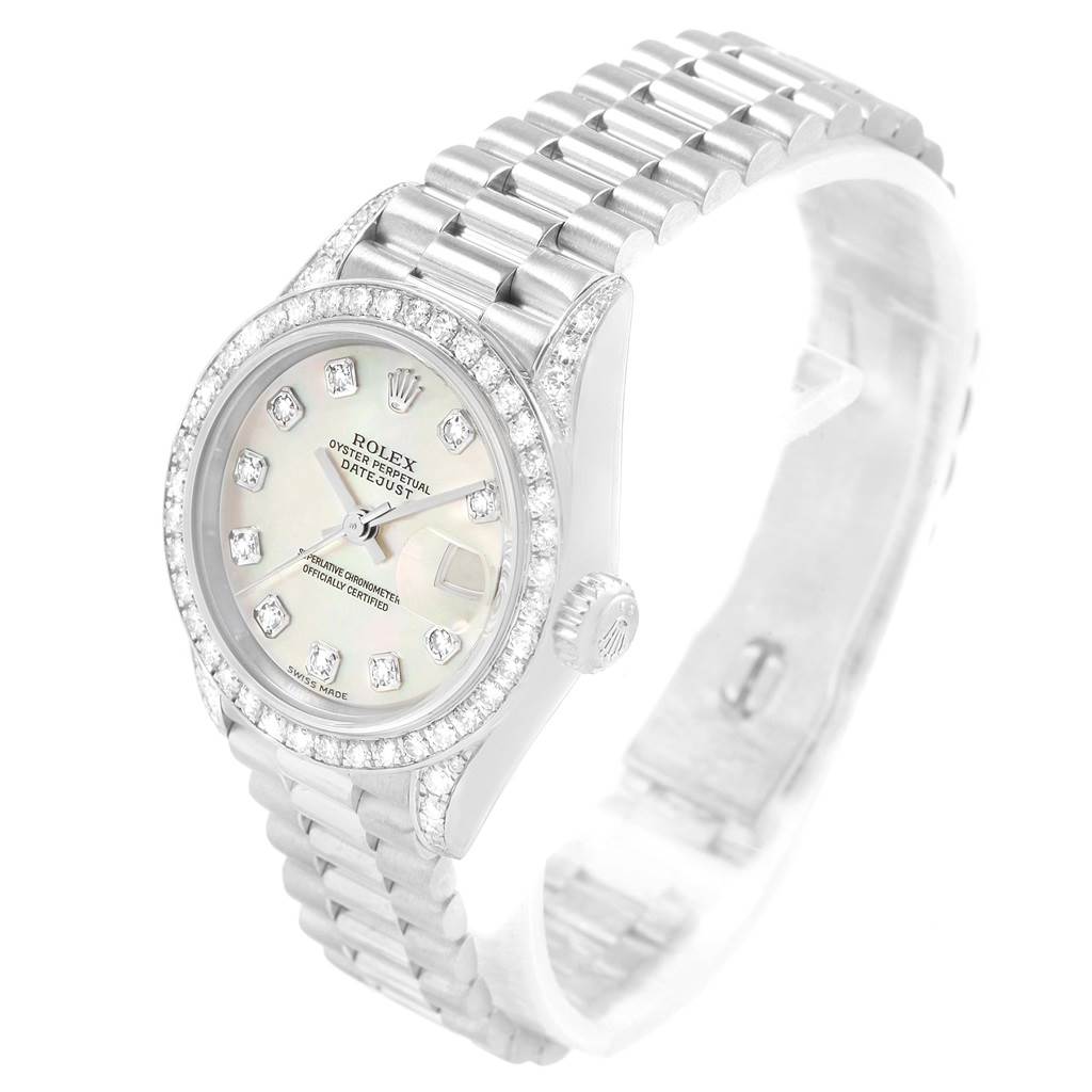 The Rolex President 79159 Women's White Gold Mother of Pearl Dial 79159 Women's White Gold Mother of Pearl Dial model watch in this image is shown at an angle highlighting the face, crown, and part of the bracelet.