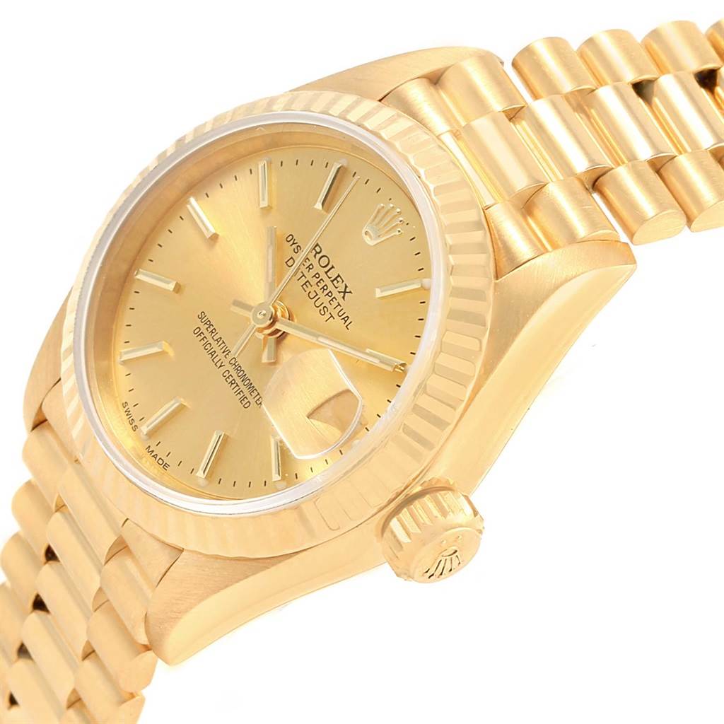 The image shows a close-up angle of the Rolex President 69178 Women's Yellow Gold Champagne Dial 69178 Women's Yellow Gold Champagne Dial watch, highlighting its gold dial, fluted bezel, and bracelet.
