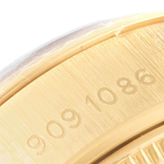 This close-up image shows the serial number engraving on the side of the bezel of a Rolex President 69178 Women's Yellow Gold Champagne Dial 69178 Women's Yellow Gold Champagne Dial model watch.
