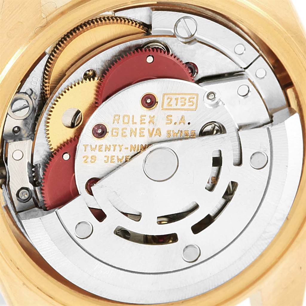 This image shows the inner mechanical movement of a Rolex President 69178 Women's Yellow Gold Champagne Dial 69178 Women's Yellow Gold Champagne Dial model watch, highlighting gears and the rotor.