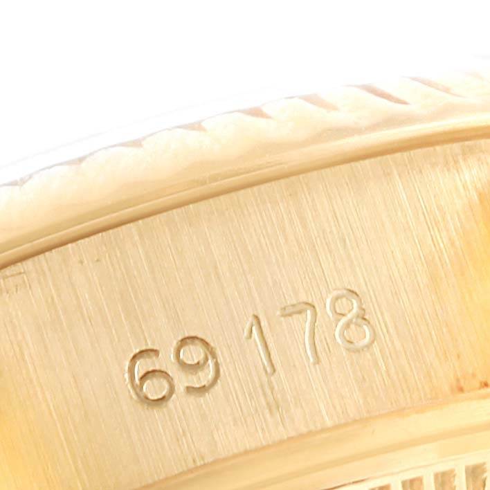 This close-up shows the side of the case and part of the bezel on the Rolex President 69178 Women's Yellow Gold Champagne Dial 69178 Women's Yellow Gold Champagne Dial model watch.