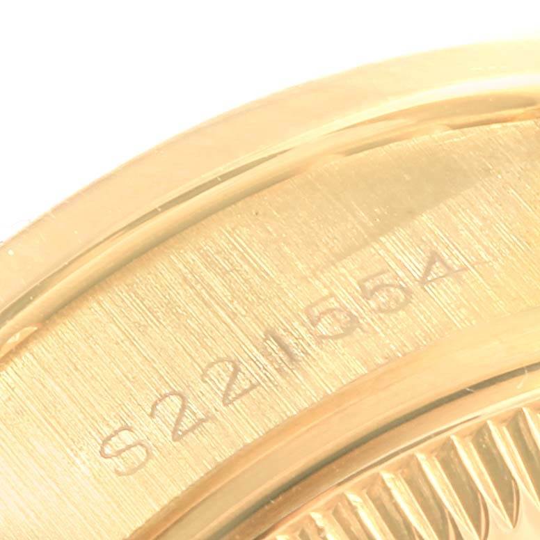 This image shows a close-up of the serial number engraved on the side of a Rolex President 69088 Women's Yellow Gold Blue Dial 69088 Women's Yellow Gold Blue Dial watch case.