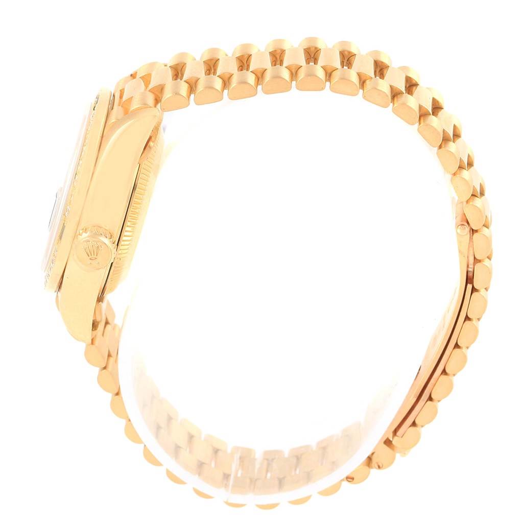 The side view of the Rolex President 69088 Women's Yellow Gold Blue Dial 69088 Women's Yellow Gold Blue Dial model shows the crown and gold bracelet.