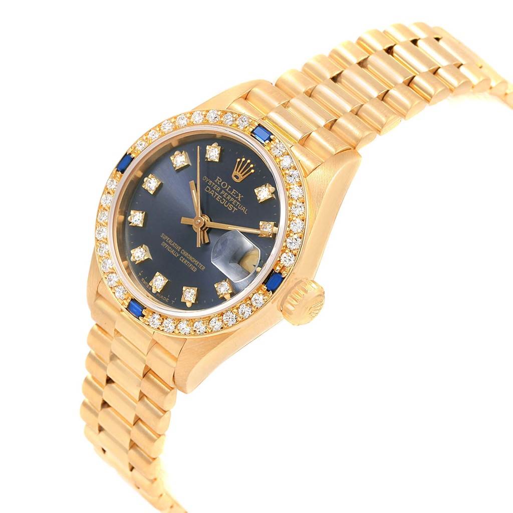 The image shows a Rolex President 69088 Women's Yellow Gold Blue Dial 69088 Women's Yellow Gold Blue Dial model watch at an angled view, displaying the face, band, and crown.