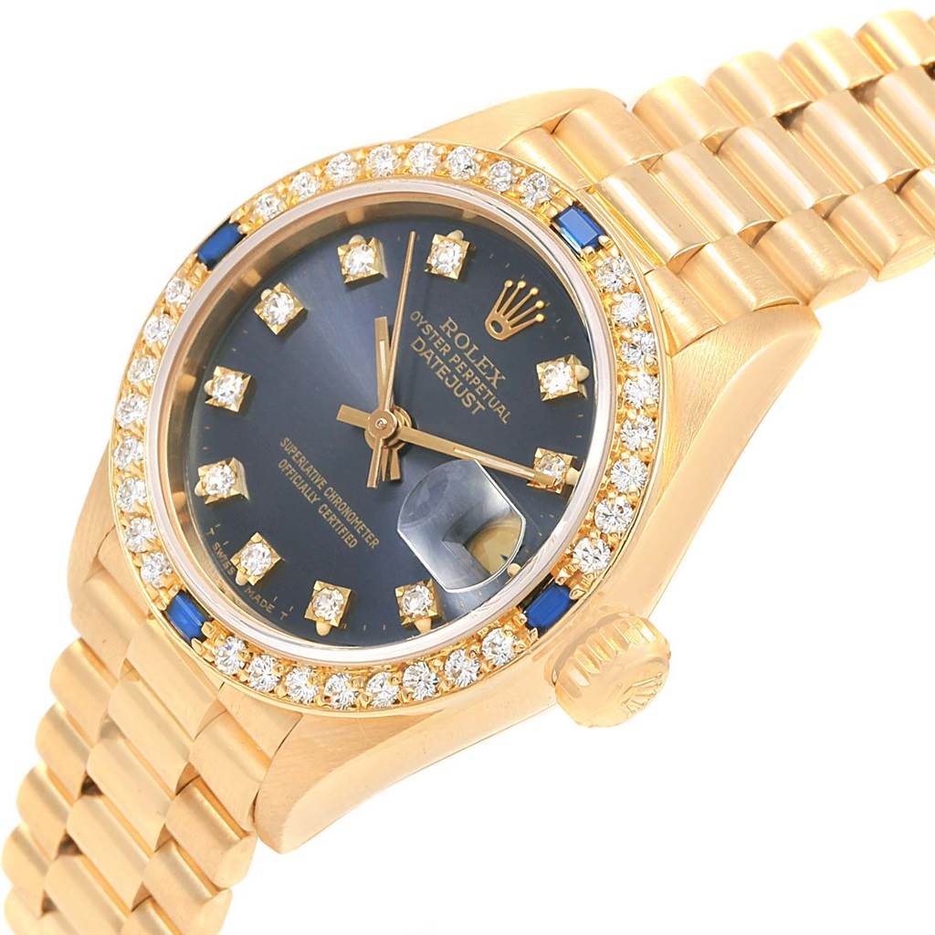 This image shows a diagonal close-up of the Rolex President 69088 Women's Yellow Gold Blue Dial 69088 Women's Yellow Gold Blue Dial model watch, highlighting its gold bracelet, bezel, and dial.