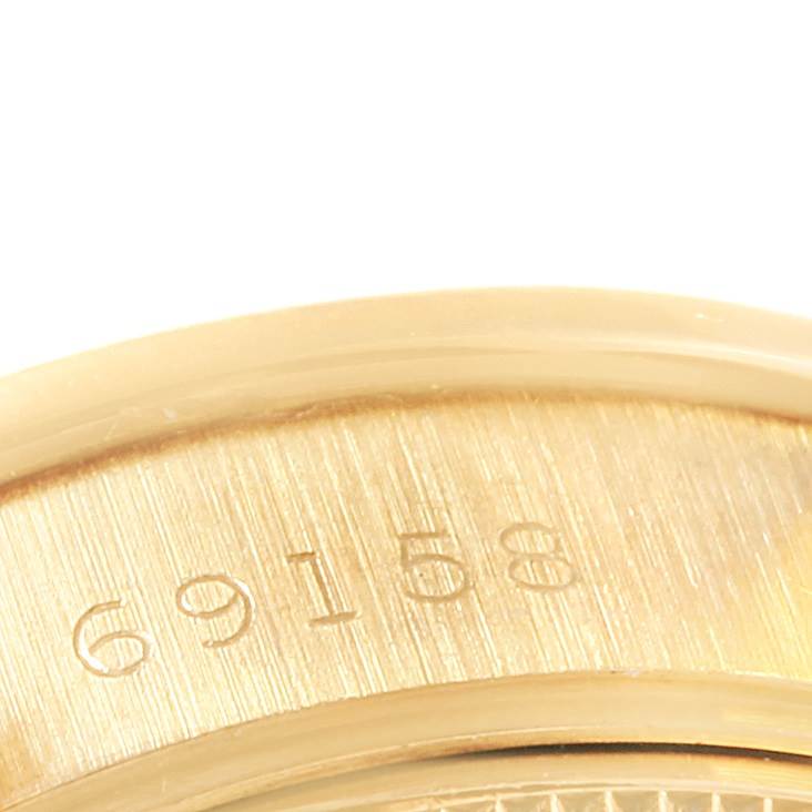 Close-up of the model number engraving on the side of a Rolex President 69198 Women
s Yellow Gold Champagne Dial 69198 Women
s Yellow Gold Champagne Dial watch.