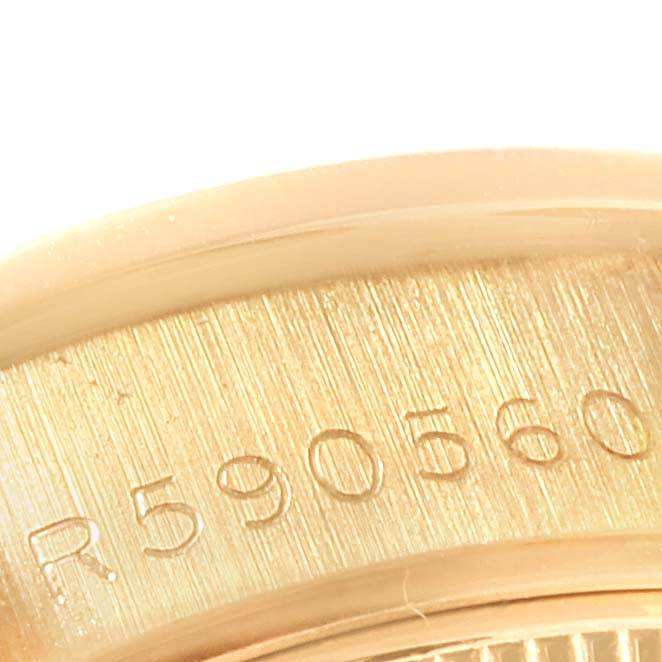 This image is a close-up of the serial number engraving on a Rolex President 69198 Women
s Yellow Gold Champagne Dial 69198 Women
s Yellow Gold Champagne Dial model watch.