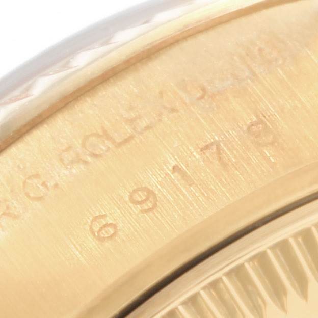 This close-up image shows the serial number engraving on the case of a Rolex President 69178 Women
s Yellow Gold Champagne Dial 69178 Women
s Yellow Gold Champagne Dial model watch.