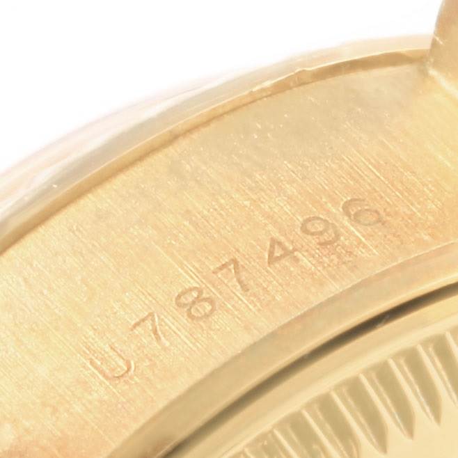 This image shows a close-up of the inner case back with serial number engraving on a Rolex President 69178 Women
s Yellow Gold Champagne Dial 69178 Women
s Yellow Gold Champagne Dial model watch.