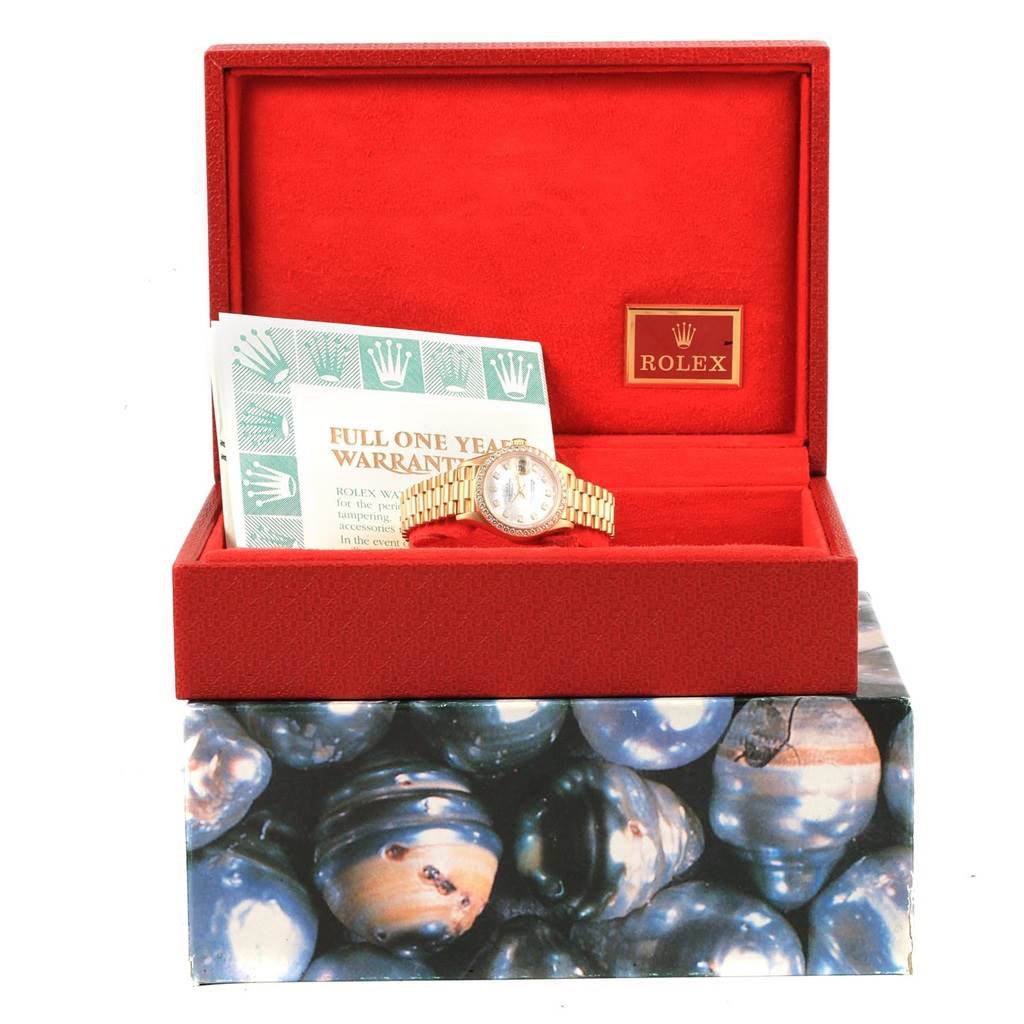 The image shows a Rolex President 79138 Women
s Yellow Gold Champagne Dial 79138 Women
s Yellow Gold Champagne Dial model watch, straight-on in its red box with warranty documents.