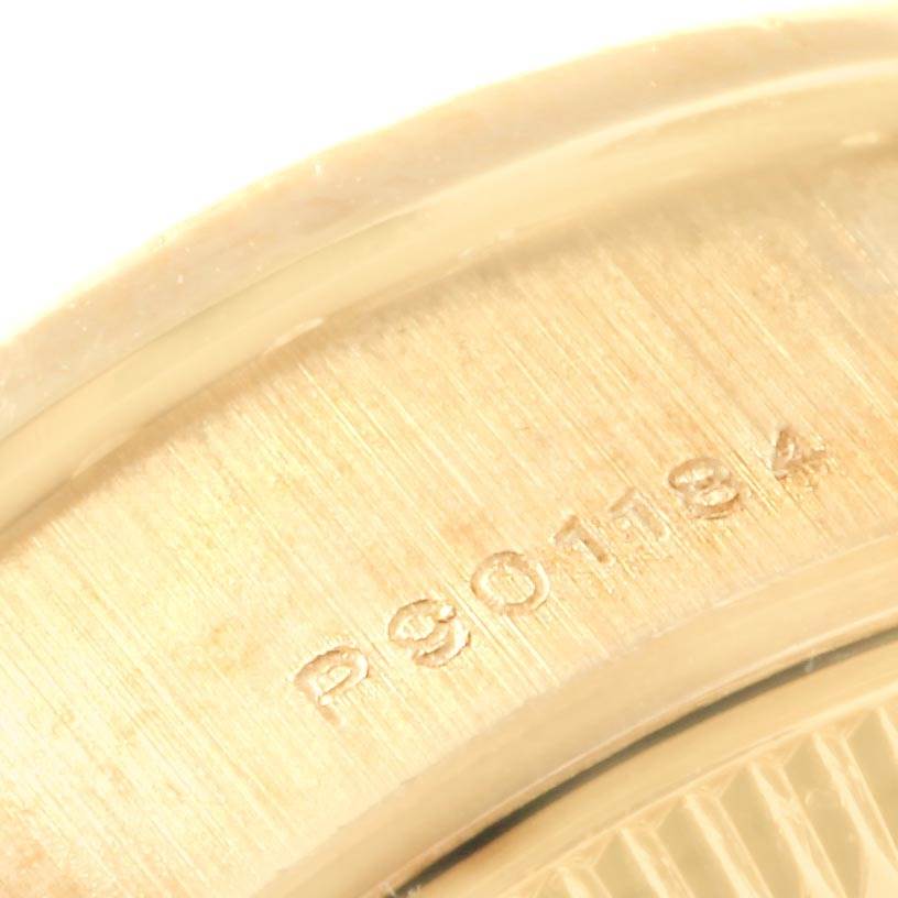 The image shows a close-up angle of the serial number on the case back of a Rolex President 79138 Women
s Yellow Gold Champagne Dial 79138 Women
s Yellow Gold Champagne Dial model watch.