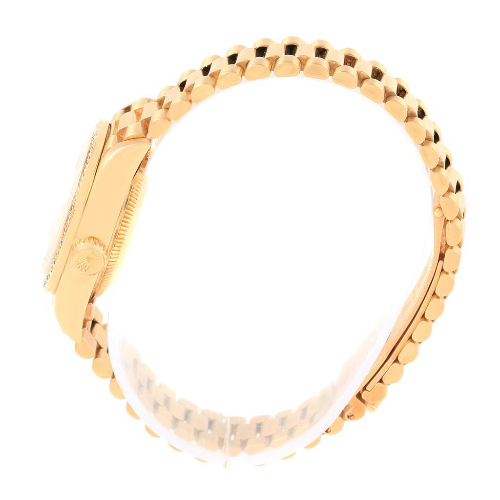 The image shows a side view of the Rolex President 69138 Women's Yellow Gold Silver Dial 69138 Women's Yellow Gold Silver Dial model watch, highlighting the crown and the bracelet's links.