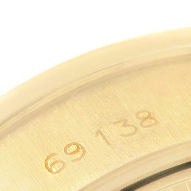 This close-up image shows the engraved model number on the case back of a Rolex President 69138 Women's Yellow Gold Silver Dial 69138 Women's Yellow Gold Silver Dial watch.
