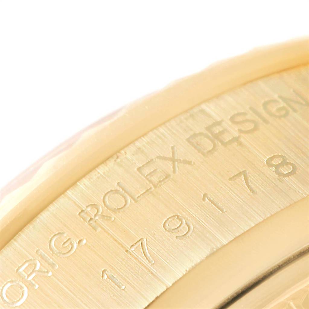The image shows a close-up of the side engraving on the bezel of a Rolex President 179178 Women's Yellow Gold Black Dial 179178 Women's Yellow Gold Black Dial model watch.
