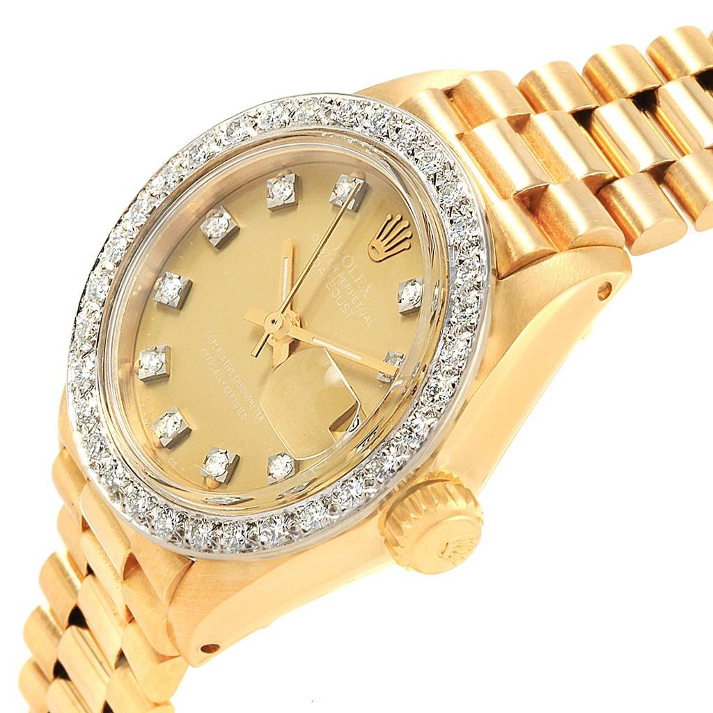 This image shows a close-up, angled view of a Rolex President 6917 Women
s Yellow Gold Champagne Dial 6917 Women
s Yellow Gold Champagne Dial model watch, highlighting the dial, bezel, and crown.