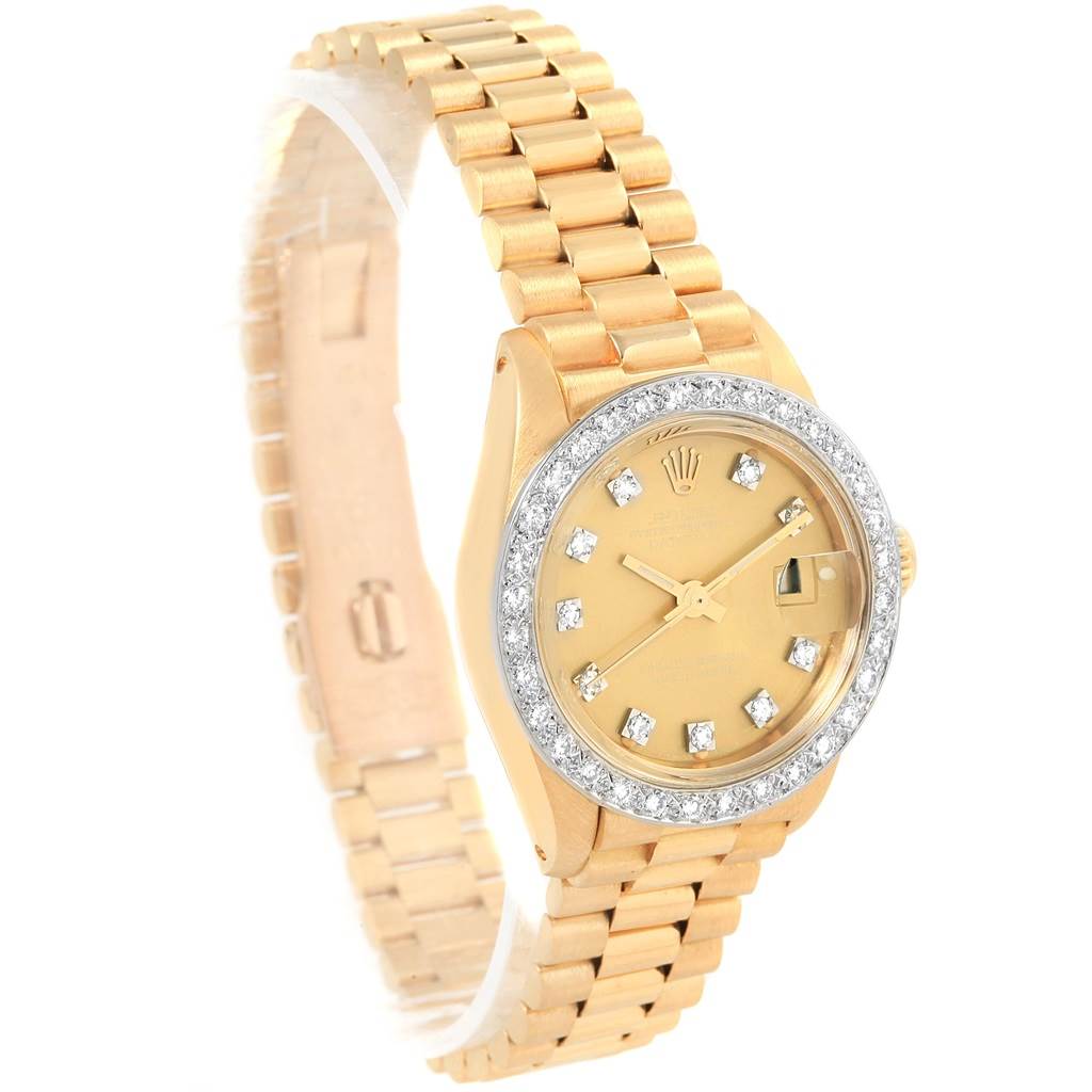 The image displays a Rolex President 6917 Women
s Yellow Gold Champagne Dial 6917 Women
s Yellow Gold Champagne Dial model watch viewed from a front angle, showing its face, bezel, and bracelet.