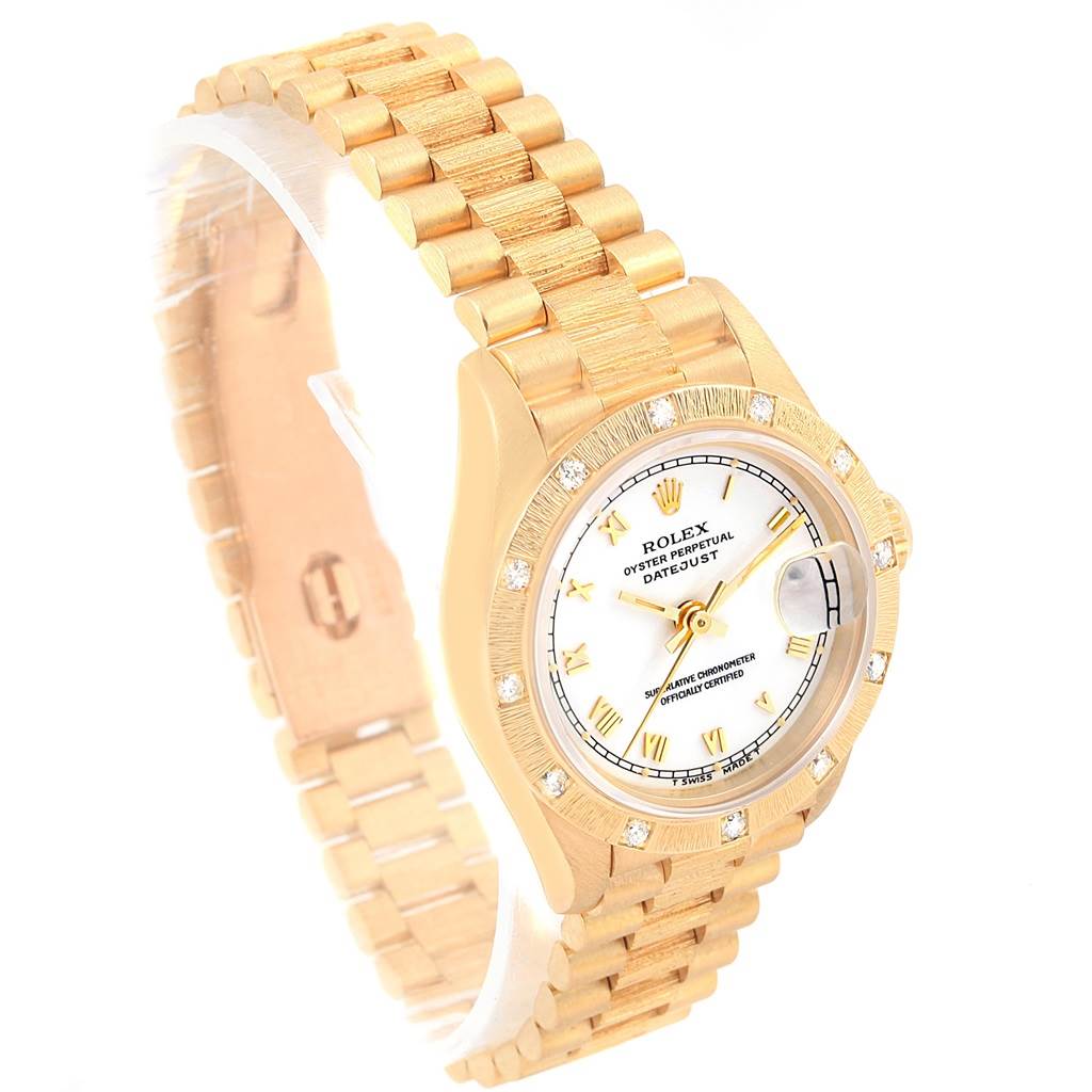This Rolex President 69288 Women
s Yellow Gold White Dial 69288 Women
s Yellow Gold White Dial model watch is shown at a slight angle, highlighting its gold band, bezel, and white dial.