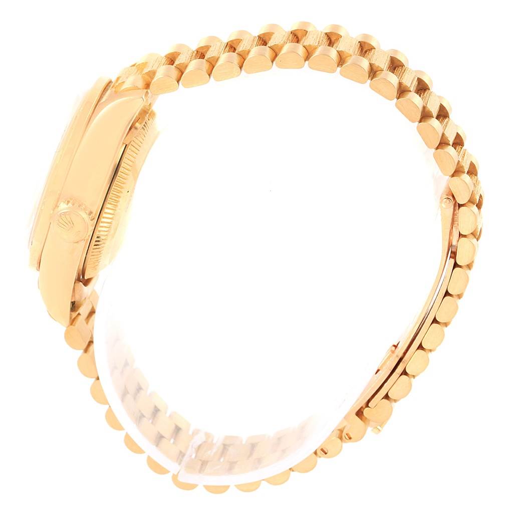 The image shows a side view of a Rolex President 69288 Women
s Yellow Gold White Dial 69288 Women
s Yellow Gold White Dial model watch, focusing on its gold case and bracelet.