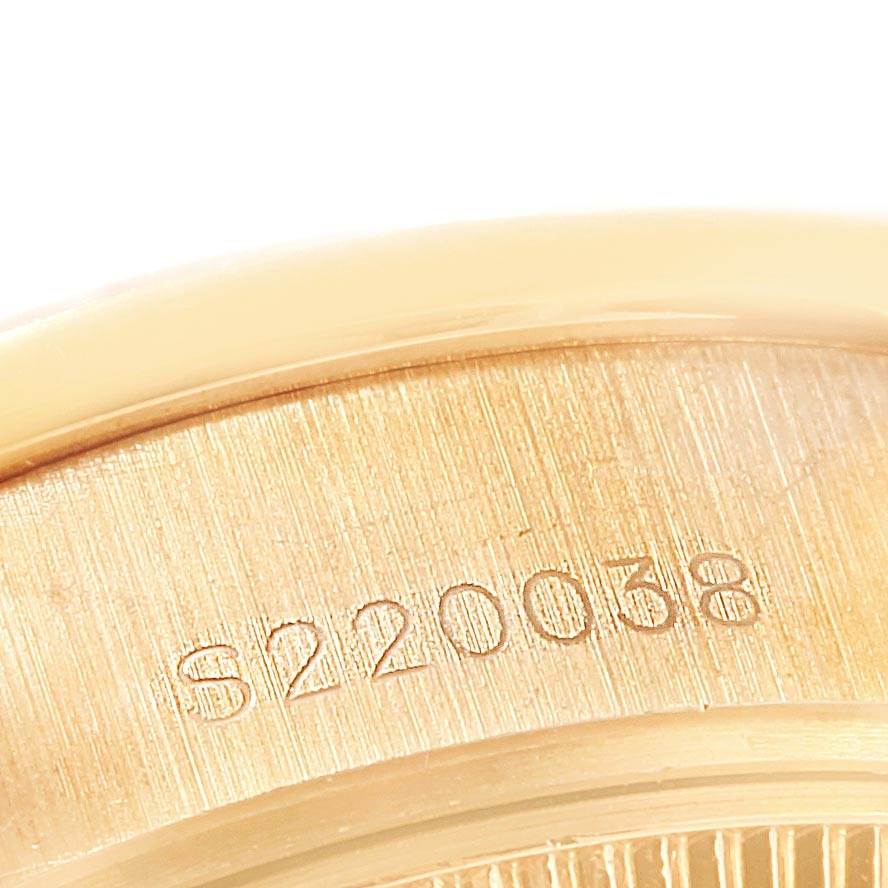 The image shows a close-up of the serial number engraving on the case back of the Rolex President 69288 Women
s Yellow Gold White Dial 69288 Women
s Yellow Gold White Dial model watch.