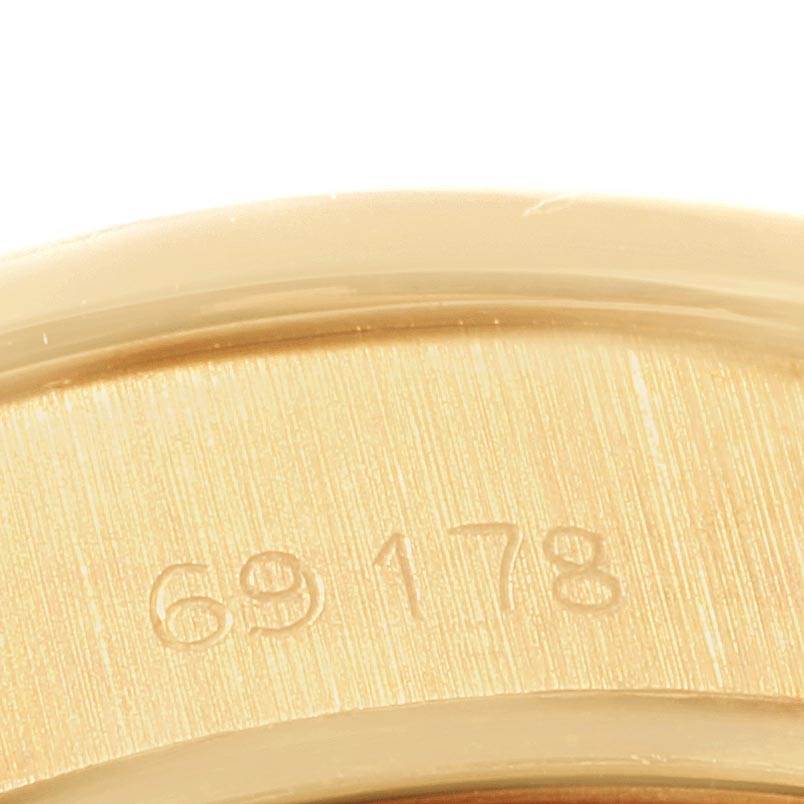 This close-up image shows the model number "69178" engraved on the Rolex President 69178 Women's Yellow Gold Blue Dial 69178 Women's Yellow Gold Blue Dial watch case.