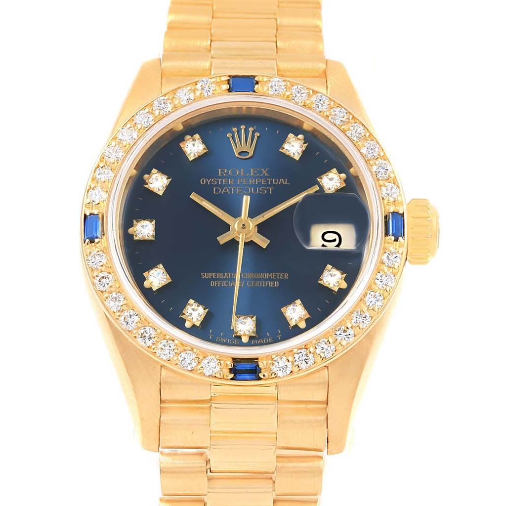 This is a front view of a Rolex President 69178 Women's Yellow Gold Blue Dial 69178 Women's Yellow Gold Blue Dial model, showcasing its golden bracelet, blue dial, and diamond-encrusted bezel.