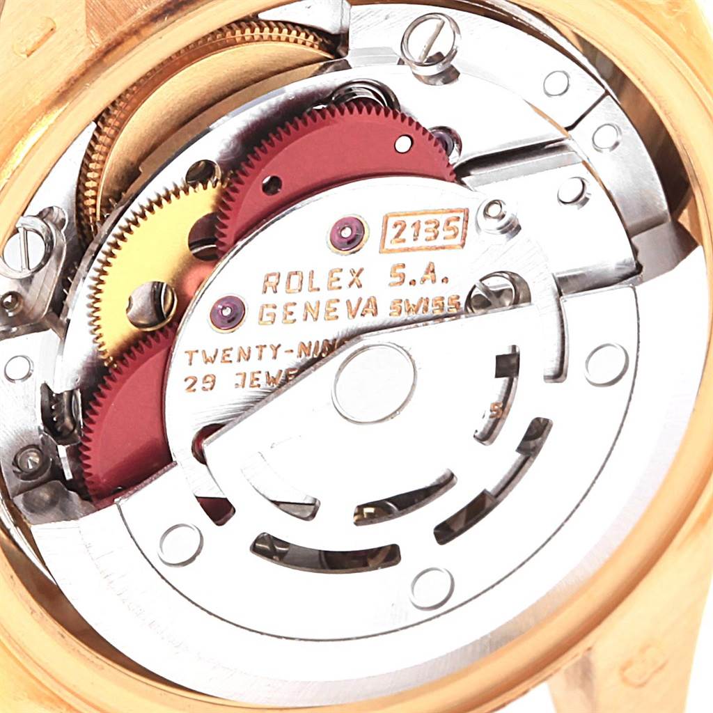 The image shows the exposed movement and intricate inner workings of a Rolex President 69178 Women's Yellow Gold Blue Dial 69178 Women's Yellow Gold Blue Dial model watch, viewed from the back.