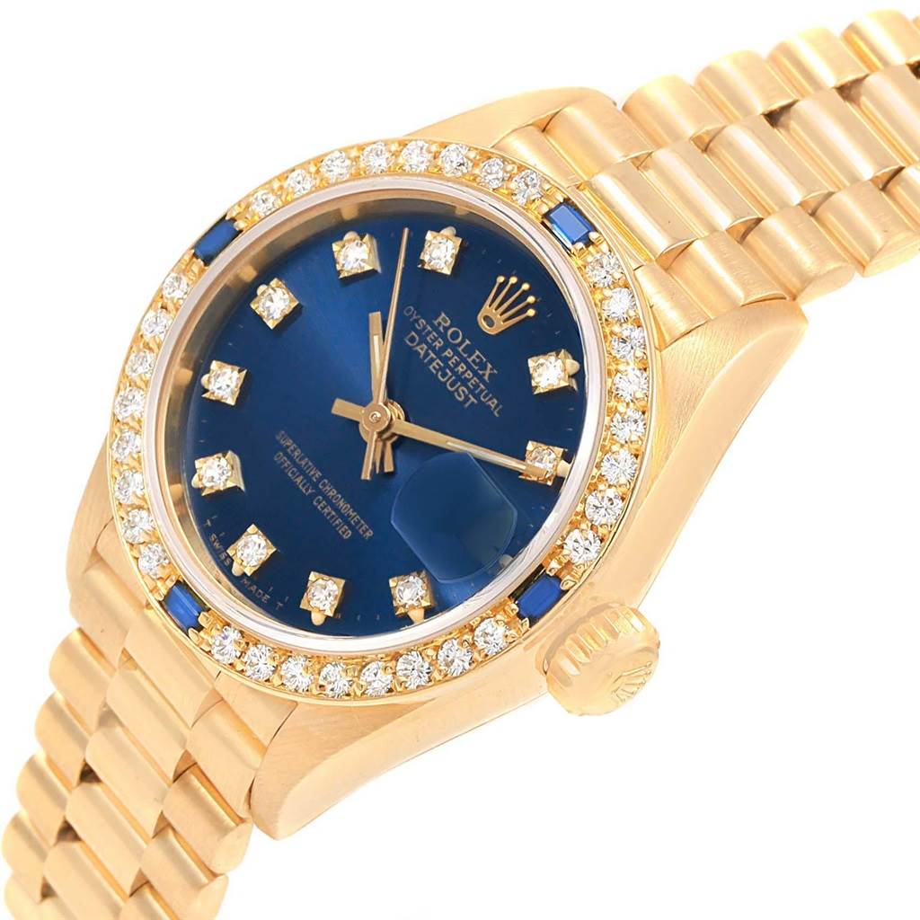 This image shows a close-up angle of a Rolex President 69178 Women's Yellow Gold Blue Dial 69178 Women's Yellow Gold Blue Dial model watch, highlighting its blue dial, diamond markers, bezel, and gold bracelet.