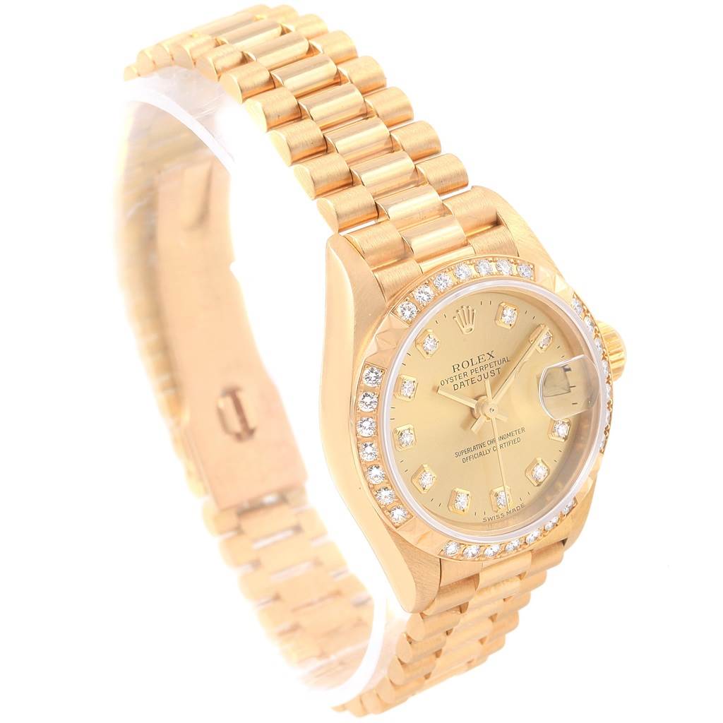 This image shows a Rolex President 79268 Women
s Yellow Gold Champagne Dial 79268 Women
s Yellow Gold Champagne Dial model watch at an angle highlighting the face, bezel, and bracelet.