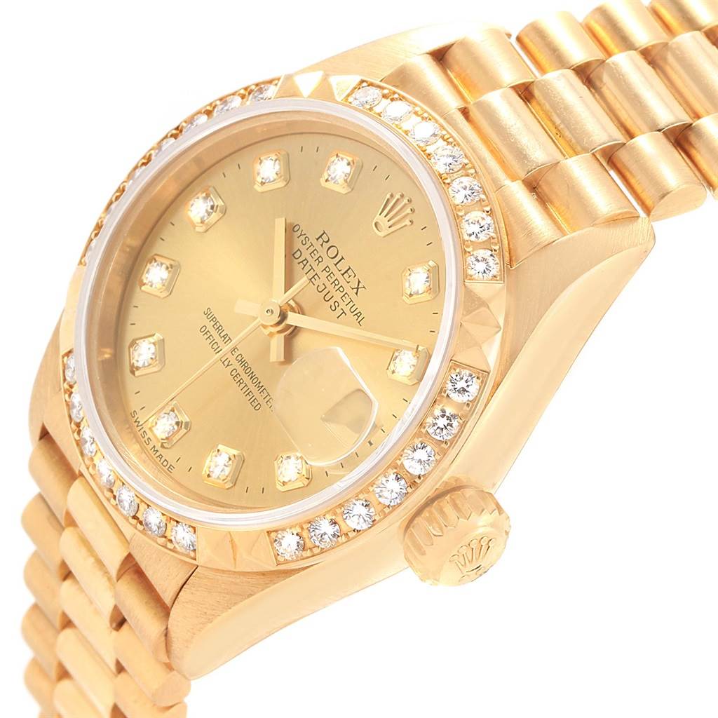 The image shows a close-up, angled view of a Rolex President 79268 Women
s Yellow Gold Champagne Dial 79268 Women
s Yellow Gold Champagne Dial model watch, highlighting its dial, bezel, and part of the bracelet.