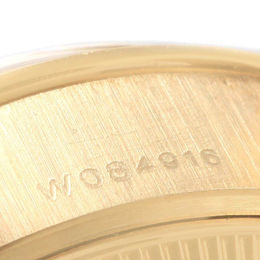 This close-up image shows the serial number engraved on the case back of a Rolex President 79268 Women
s Yellow Gold Champagne Dial 79268 Women
s Yellow Gold Champagne Dial model watch.