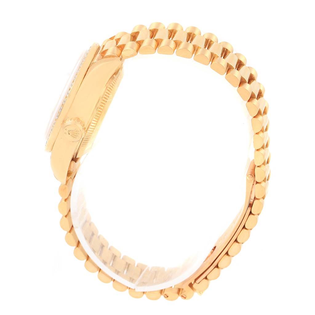 The image shows a side view of the Rolex President 79138 Women
s Yellow Gold White Dial 79138 Women
s Yellow Gold White Dial model watch, highlighting the gold case, crown, and Presidential bracelet.