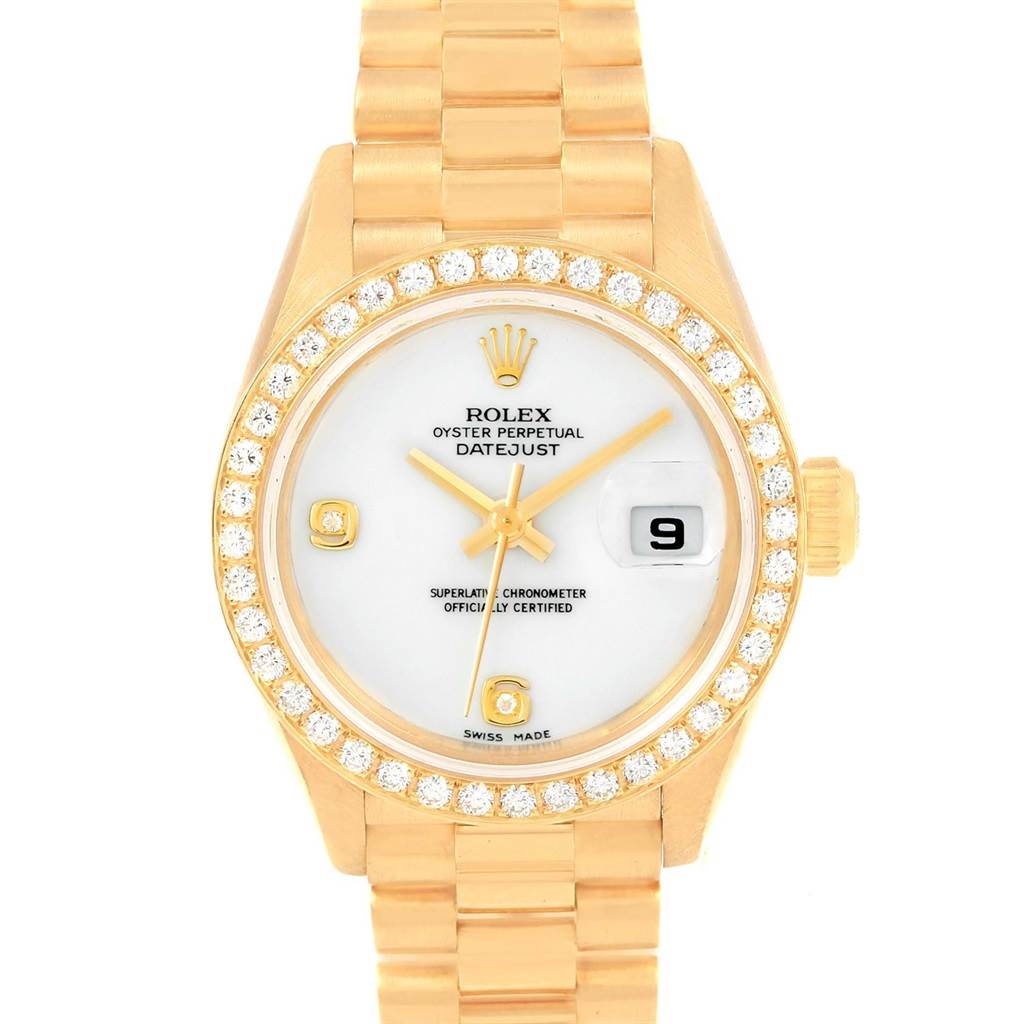 The image shows a Rolex President 79138 Women
s Yellow Gold White Dial 79138 Women
s Yellow Gold White Dial Datejust model watch in a frontal view, highlighting its gold bracelet, diamond bezel, and date display.