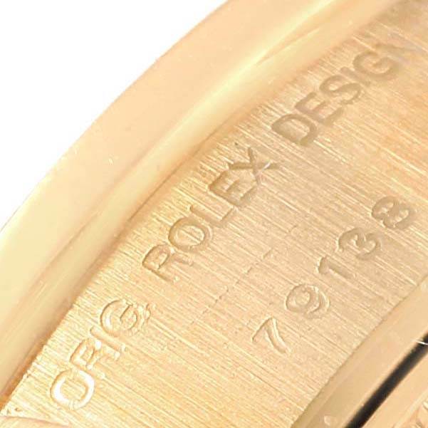 This close-up image shows the engraved inner case of a Rolex President 79138 Women
s Yellow Gold White Dial 79138 Women
s Yellow Gold White Dial watch model.