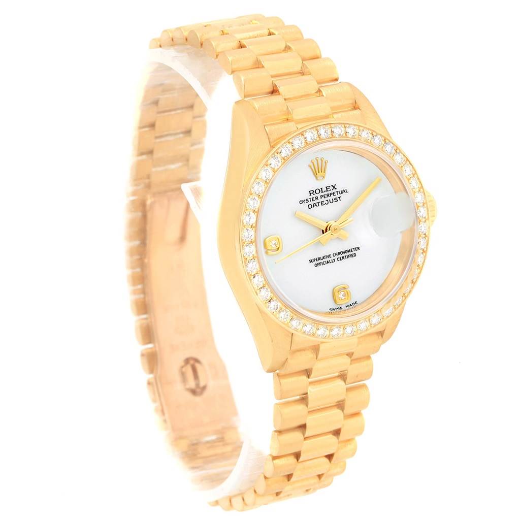 The image shows a Rolex President 79138 Women
s Yellow Gold White Dial 79138 Women
s Yellow Gold White Dial model watch at a three-quarter angle, highlighting the gold bracelet, bezel, and watch face.