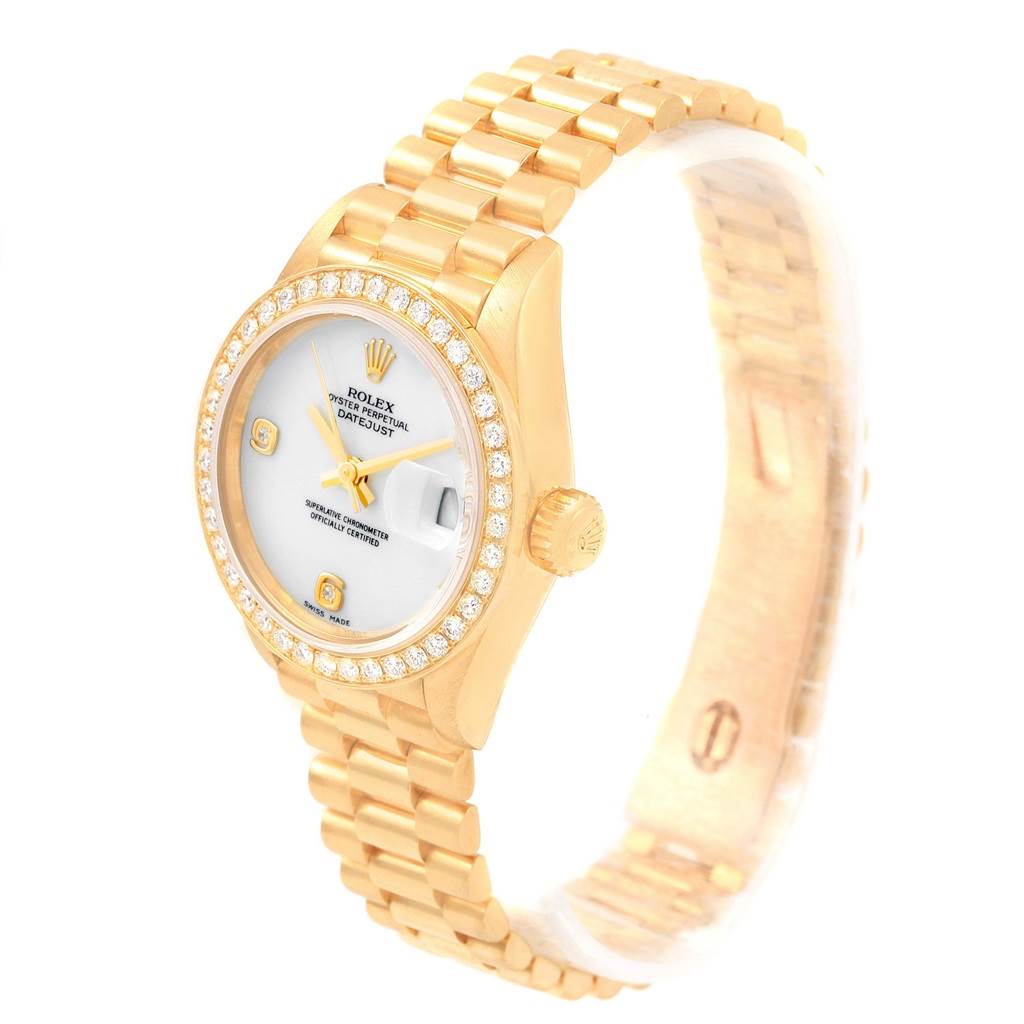 This image shows a Rolex President 79138 Women
s Yellow Gold White Dial 79138 Women
s Yellow Gold White Dial Datejust watch, featuring a gold case, diamond bezel, and bracelet, viewed from its left side.
