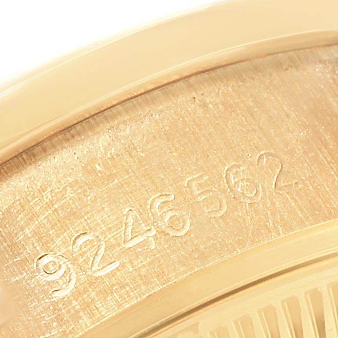 This image shows a close-up of the engraved serial number on the case back of a Rolex President 69138 Women
s Yellow Gold Champagne Dial 69138 Women
s Yellow Gold Champagne Dial watch.
