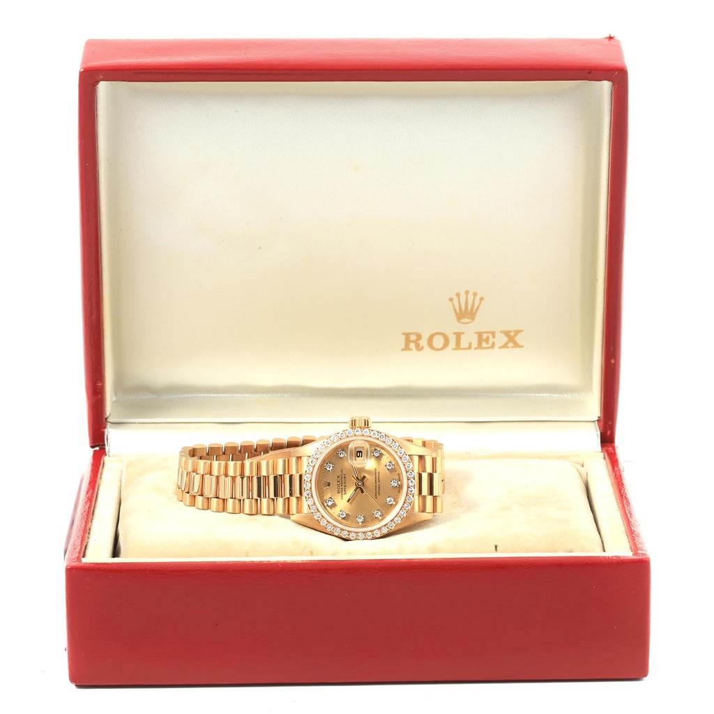 The image shows a Rolex President 69138 Women
s Yellow Gold Champagne Dial 69138 Women
s Yellow Gold Champagne Dial model watch in its open box, viewed from the front.