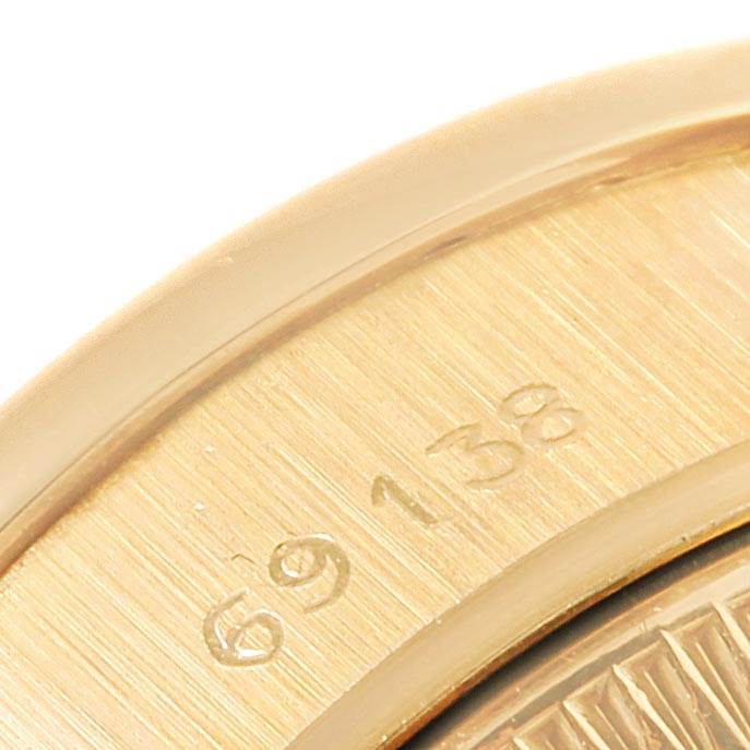 This close-up image shows the engraved model number "69138" on a Rolex President 69138 Women
s Yellow Gold Champagne Dial 69138 Women
s Yellow Gold Champagne Dial watch.