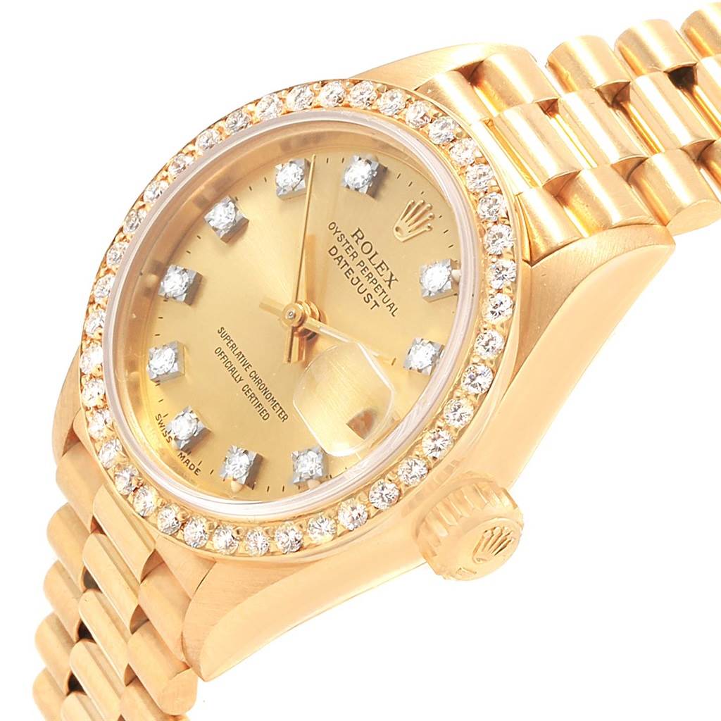 This Rolex President 69138 Women
s Yellow Gold Champagne Dial 69138 Women
s Yellow Gold Champagne Dial model is shown from a slight angle, highlighting the diamond-studded bezel, dial, and part of the bracelet.