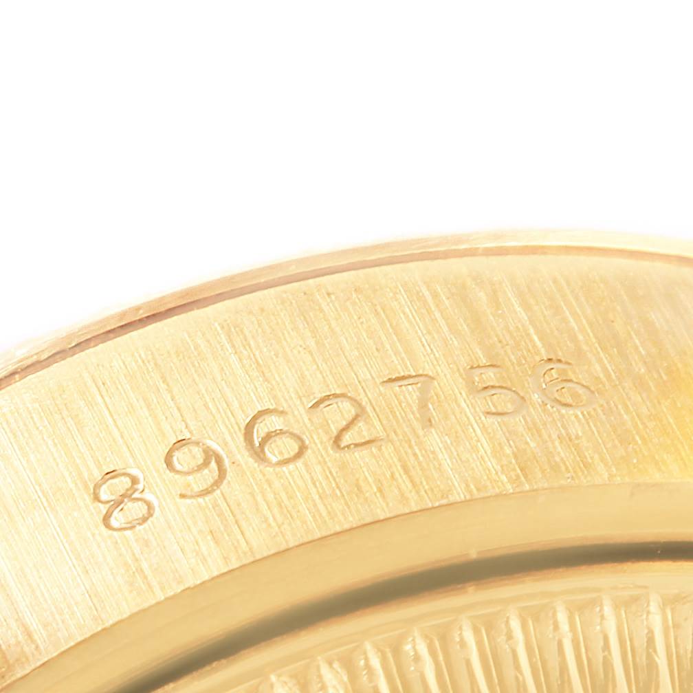 Close-up of the serial number on the gold casing of a Rolex President 69178 Women's Yellow Gold Blue Dial 69178 Women's Yellow Gold Blue Dial model watch.