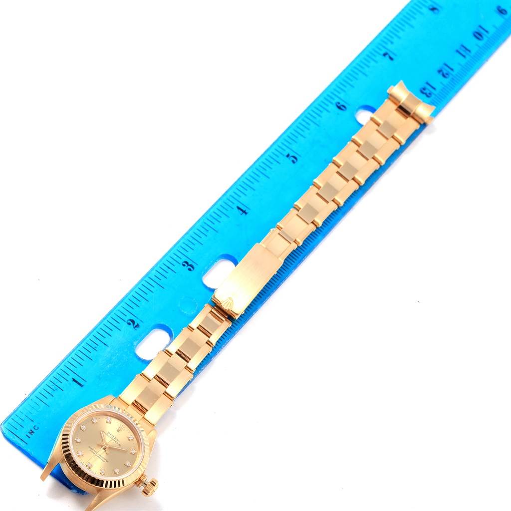 The Rolex President 67198 Women
s Yellow Gold Champagne Dial 67198 Women
s Yellow Gold Champagne Dial model watch is shown from a top-down angle, with the face, bezel, and entire bracelet visible.