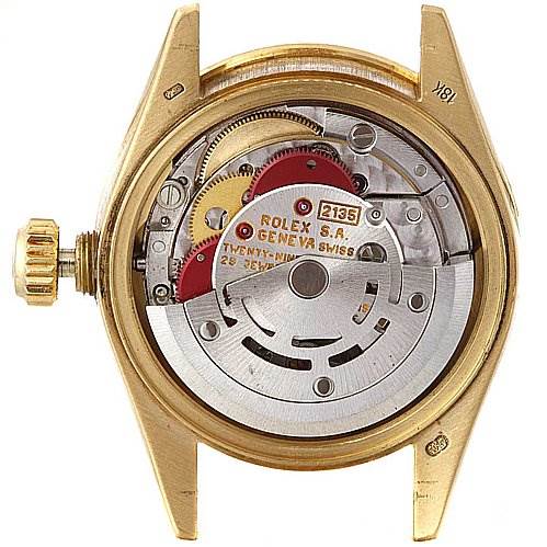 This image shows the backside of a Rolex President 69068 Women
s Yellow Gold Mother of Pearl Dial 69068 Women
s Yellow Gold Mother of Pearl Dial model watch, highlighting its intricate internal mechanics and movement parts.